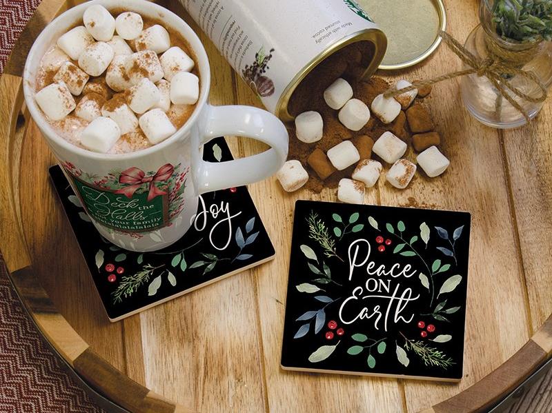 black coasters with Christmas flowers and Peace on Earth in white script