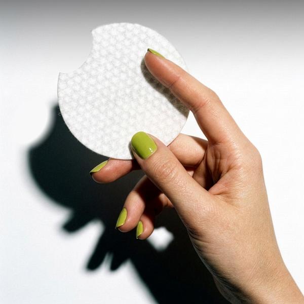 woman holding a cotton pad
