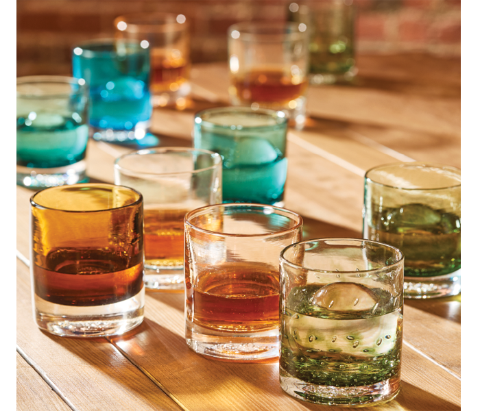 glassybaby votive candle holders in various shades of orange, yellow and pink
