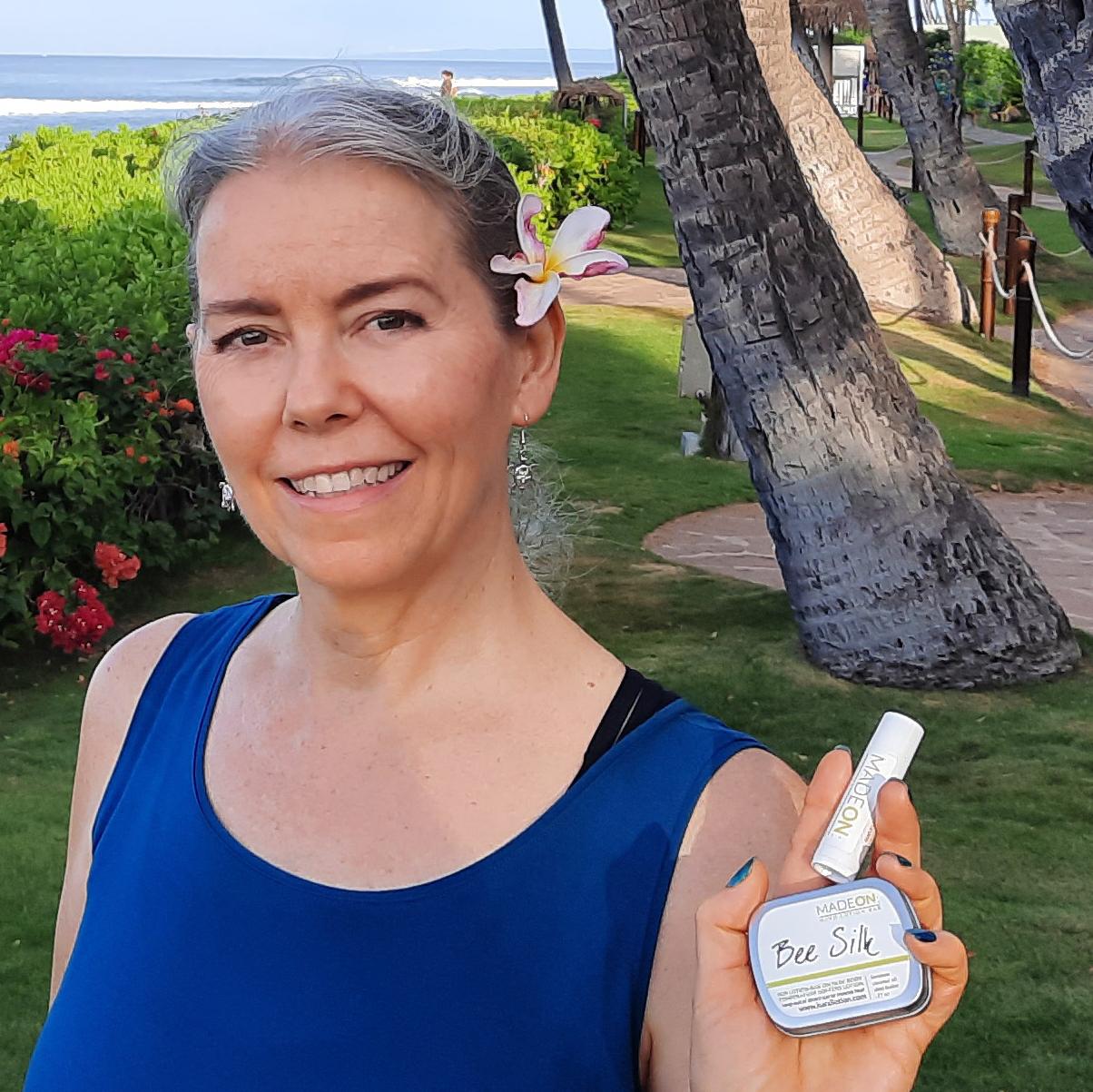 Vicki holding beesilk bar in hawaii