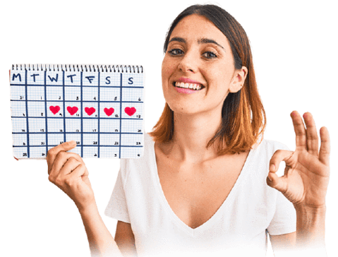 femme heureuse qui tient un calendrier menstruel