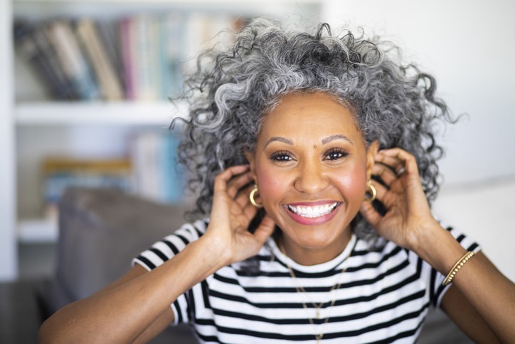 black woman smiling with gray hair