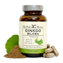 Bottle of Herbal Roots Ginkgo Biloba with capsules on the right and powder with a ginkgo leaf on the left