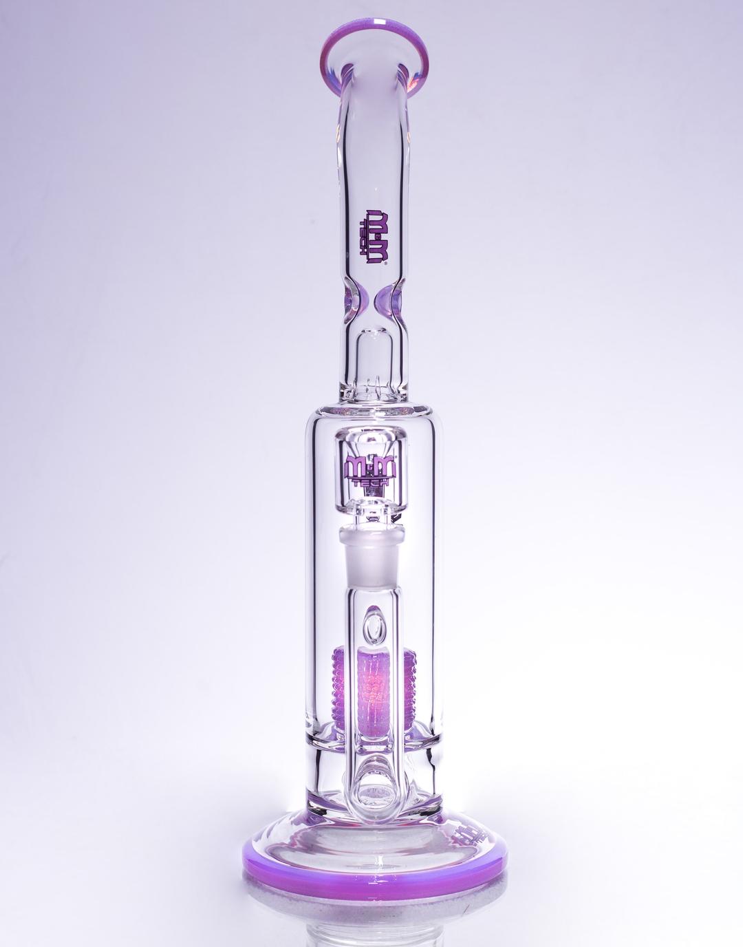 man in smoking from a glass dab rig