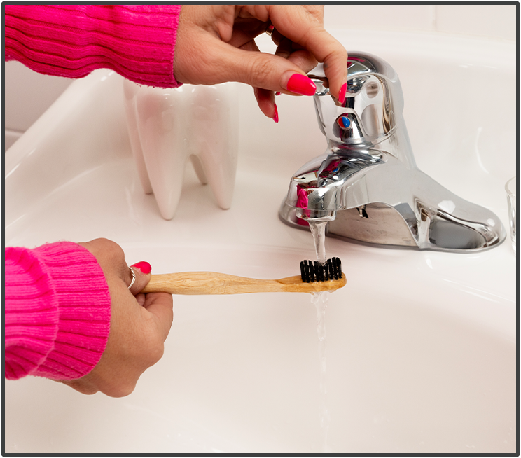 Wet your toothbrush