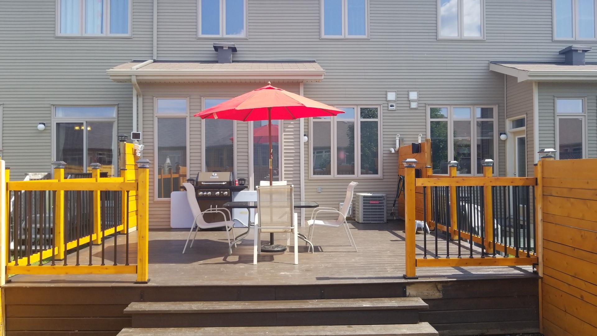 image of a floating deck beside an out of ground pool in a backyard