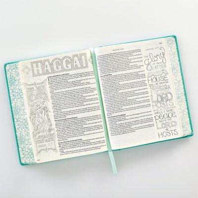 teal Bible with artwork in margins