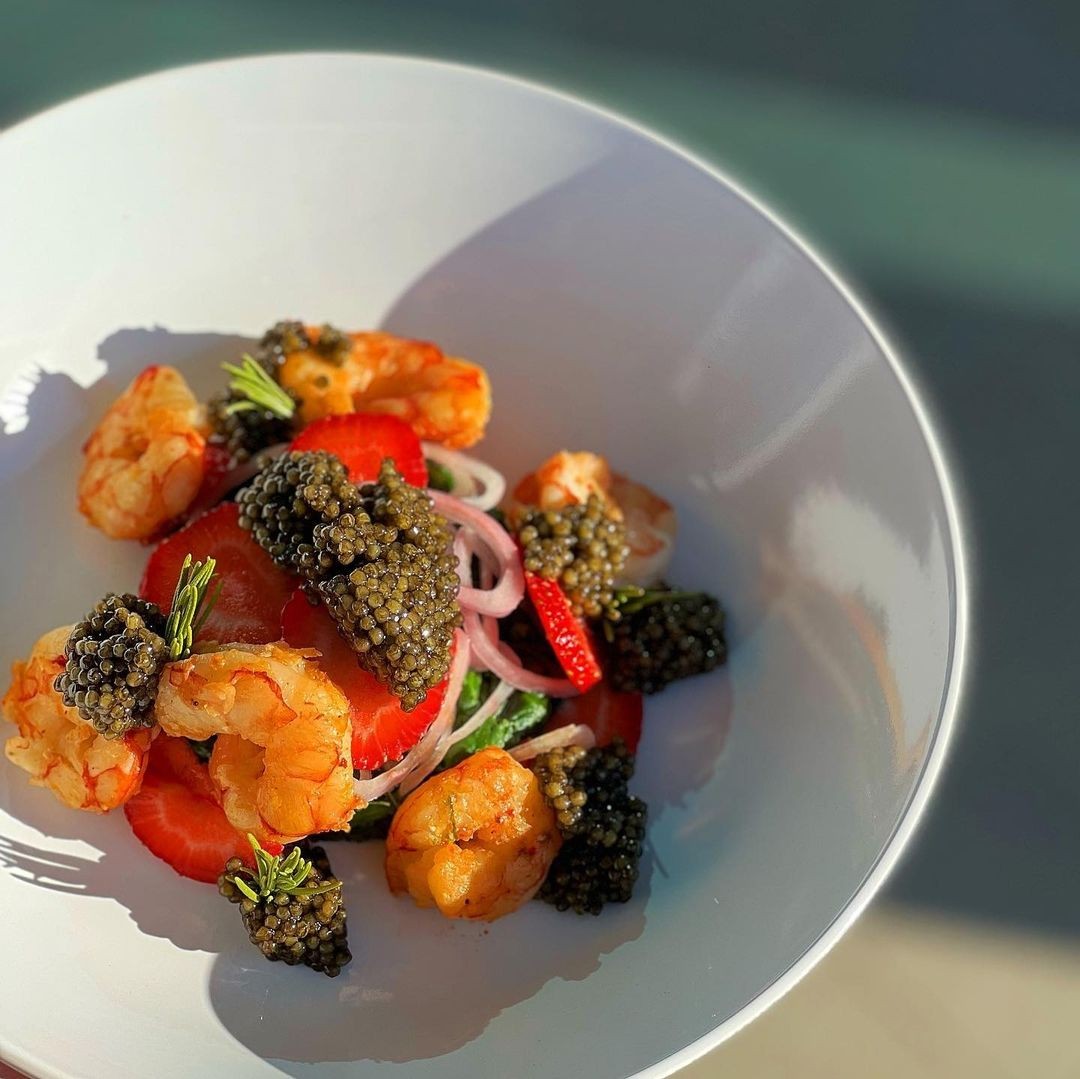 A shrimp dish topped with American caviar