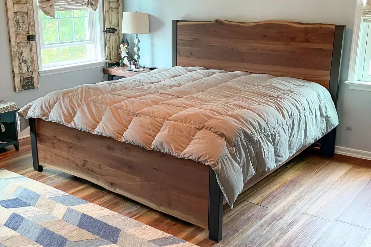 King-size live edge walnut bed with steel accents, handcrafted and delivered to a home in Gilbertsville, Pennsylvania.