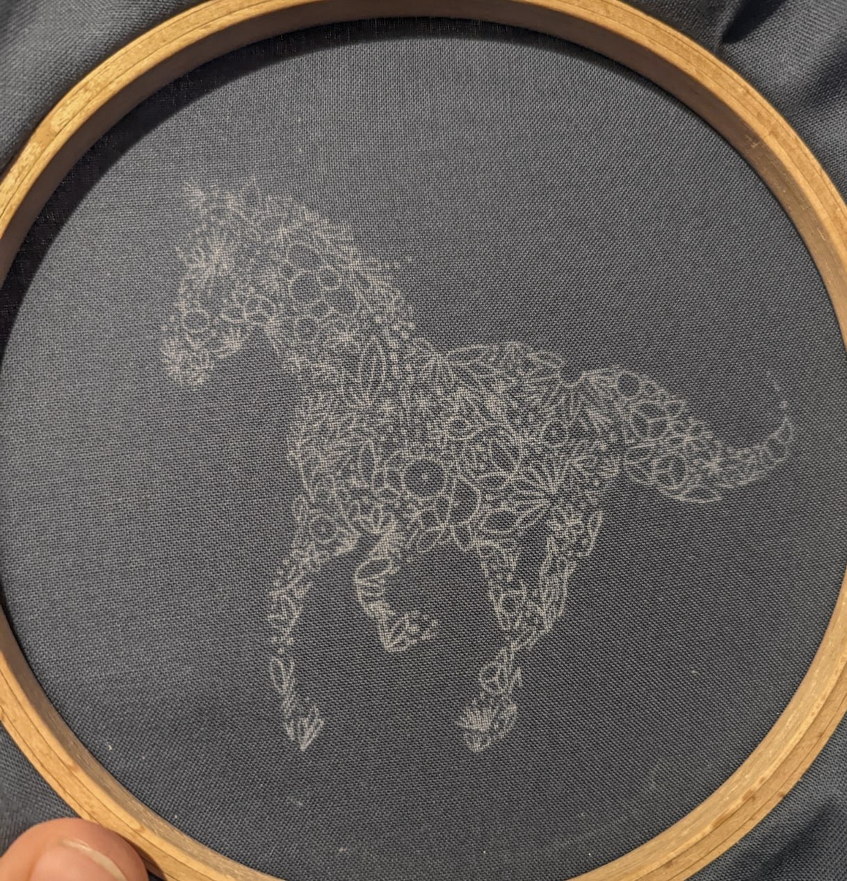 This is an example of a horse drawn onto the fabric using carbon paper.