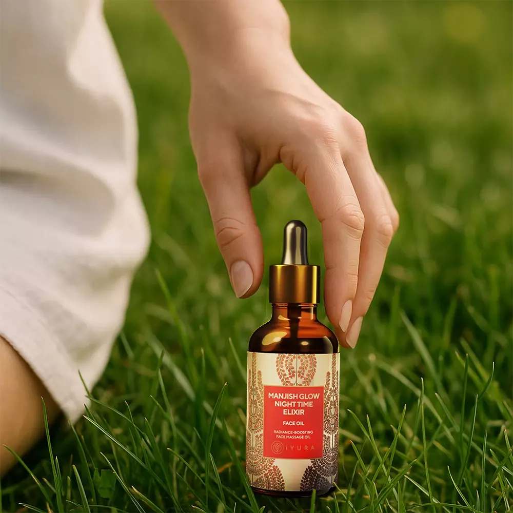 Woman about to use Manjish Glow Night Time Elixir