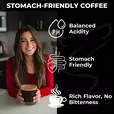 Woman holding a cup of coffee with icons highlighting balanced acidity, stomach-friendly qualities, and smooth taste — Lone Wolf Coffee