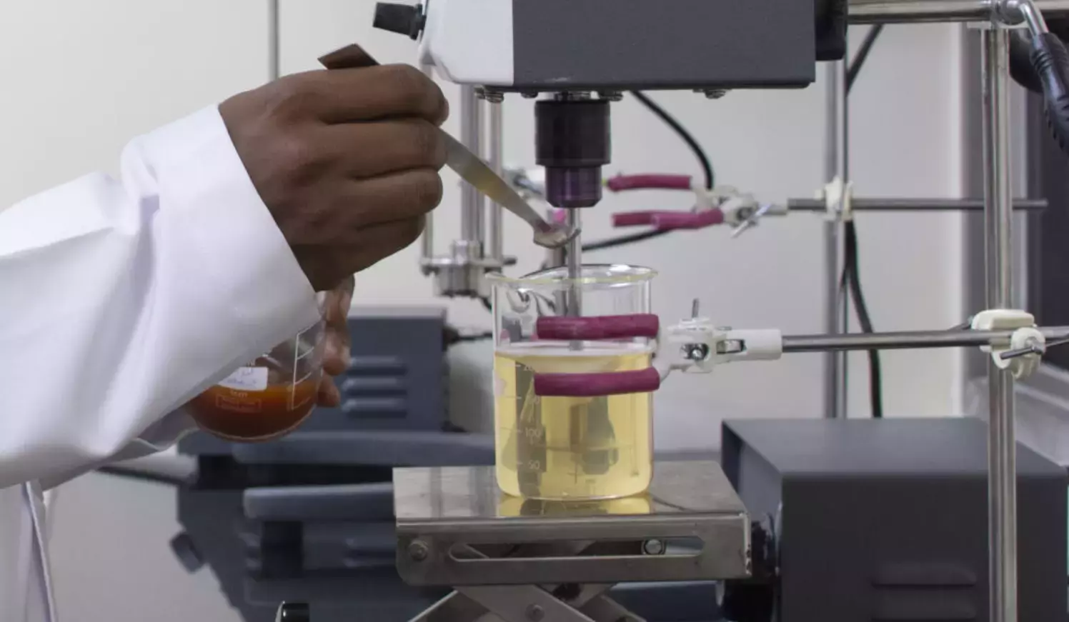 Our scientist in lab coat conducting a laboratory testing .