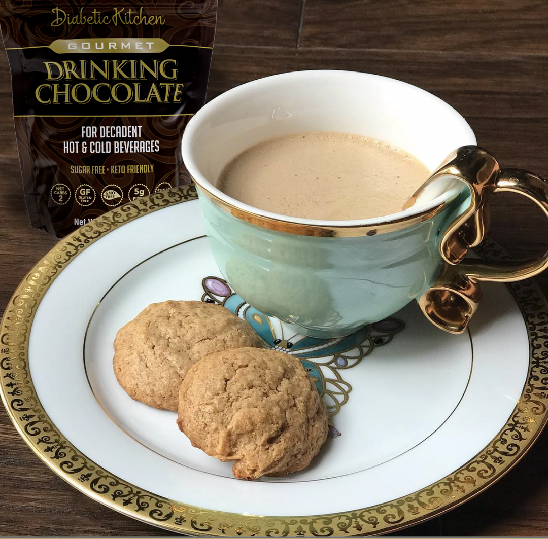 cup of drinking chocolate on platter with two cookies