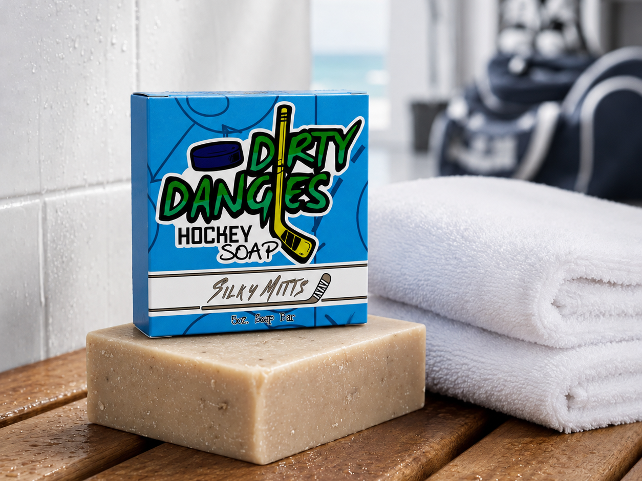 a brown silky mitts oatmeal milk and honey hockey soap bar in a locker room with a clean towel and hockey gear
