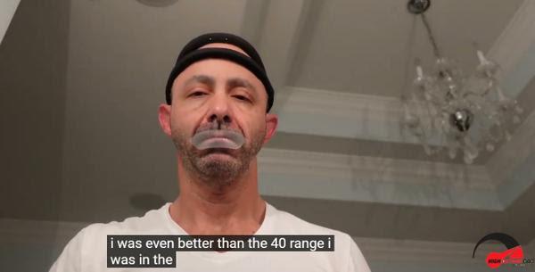 Man with Hat Having Tape on Mouth White Shirt