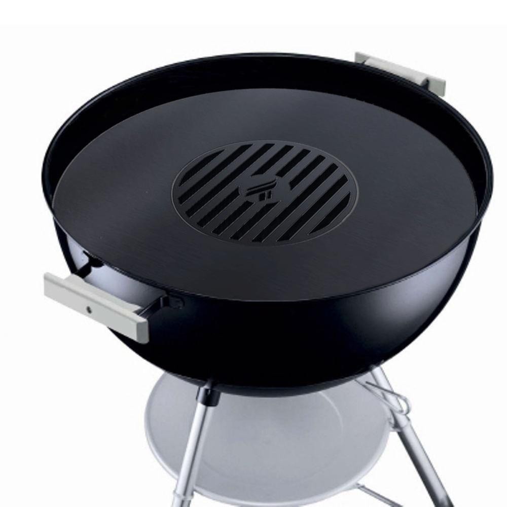 Arteflame Weber griddle insert being used to grill a variety of foods, illustrating its versatility and grilling efficiency.