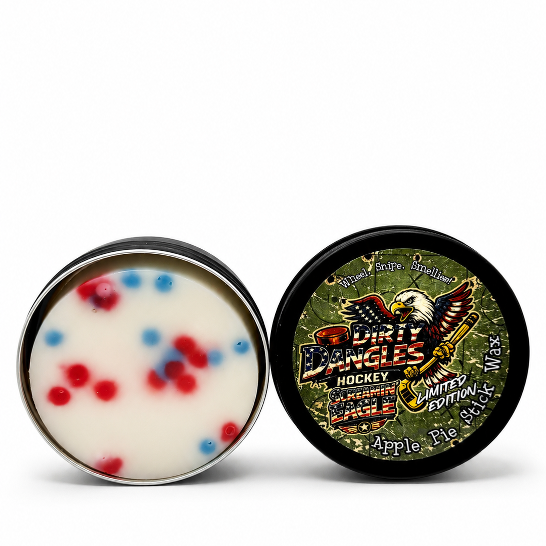 An open tin of dirty dangles screamin eagle 4th of july stick wax on a white background.
