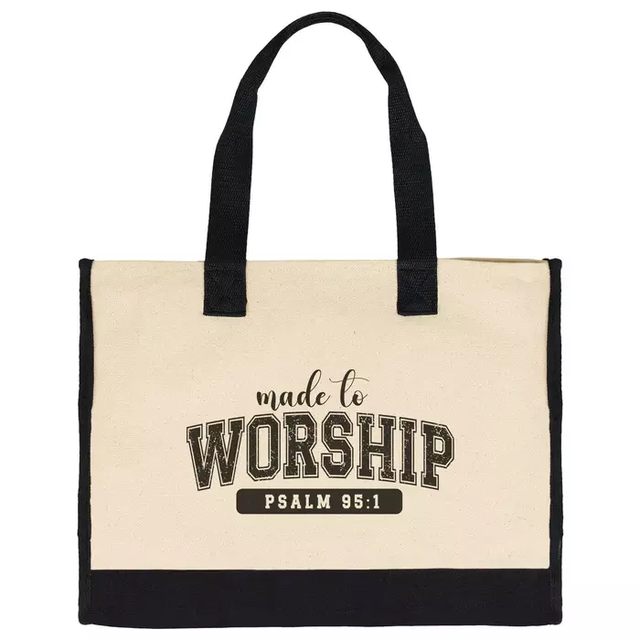 canvas tote bag with black frabic on bottom and handle, text says "made to worship psalm 95:1"