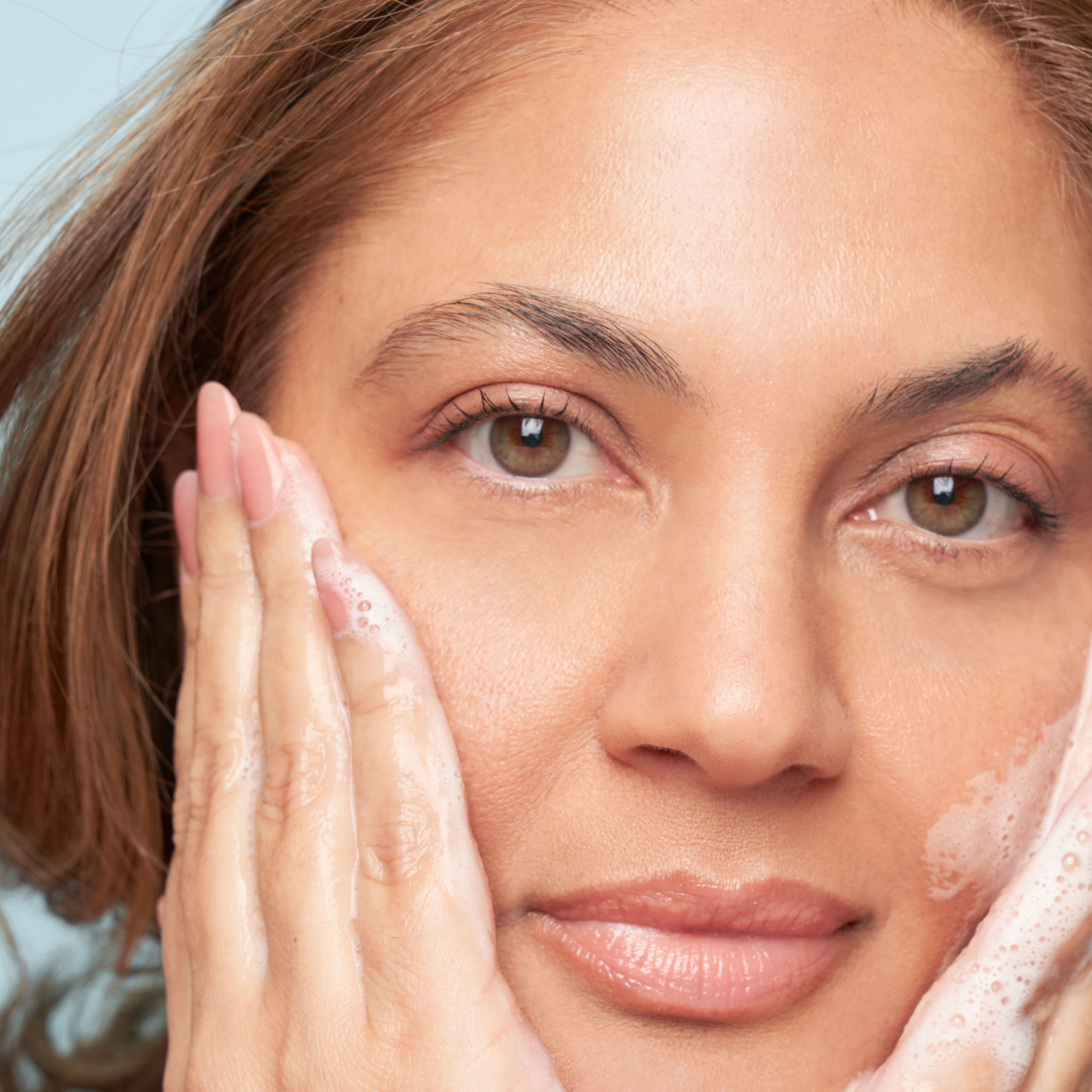 woman hydrating her skin