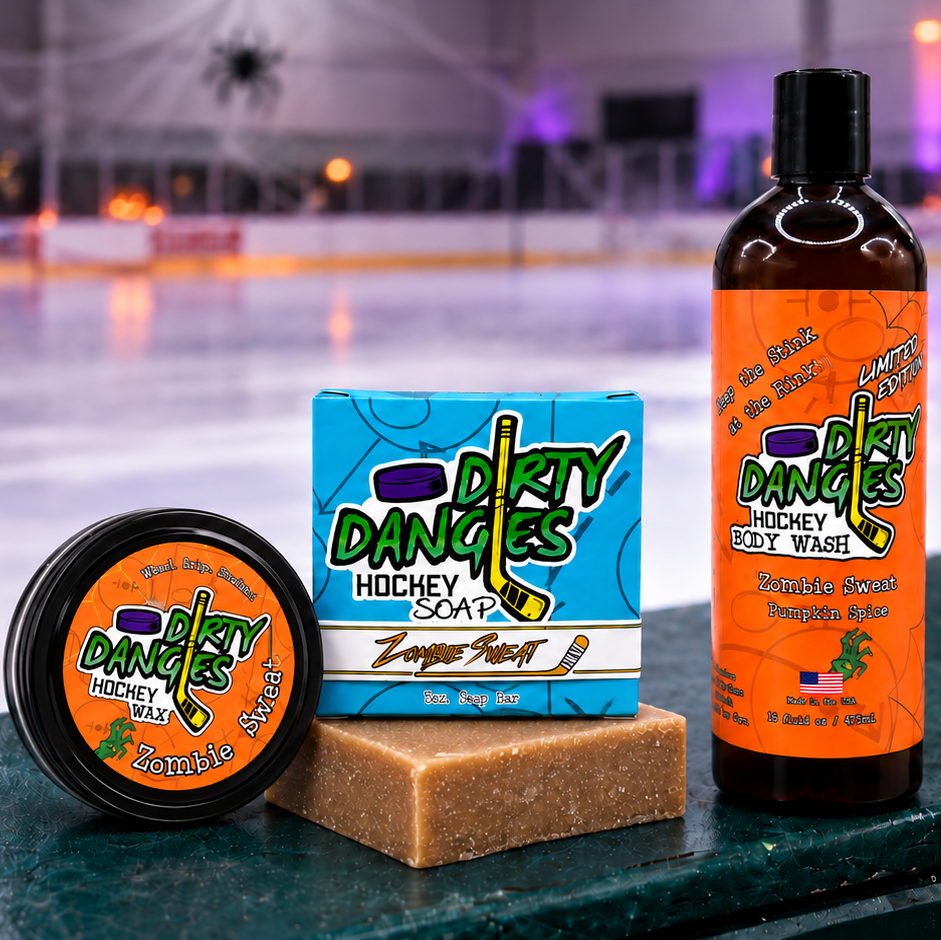 dirty dangles zombie sweat pumpkin spice scented bundle stick wax soap bar and body wash on hockey boards with halloween decor in the background