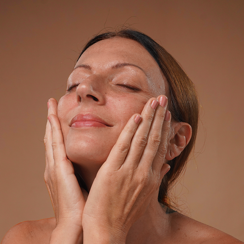 Model massaging the product into the skin