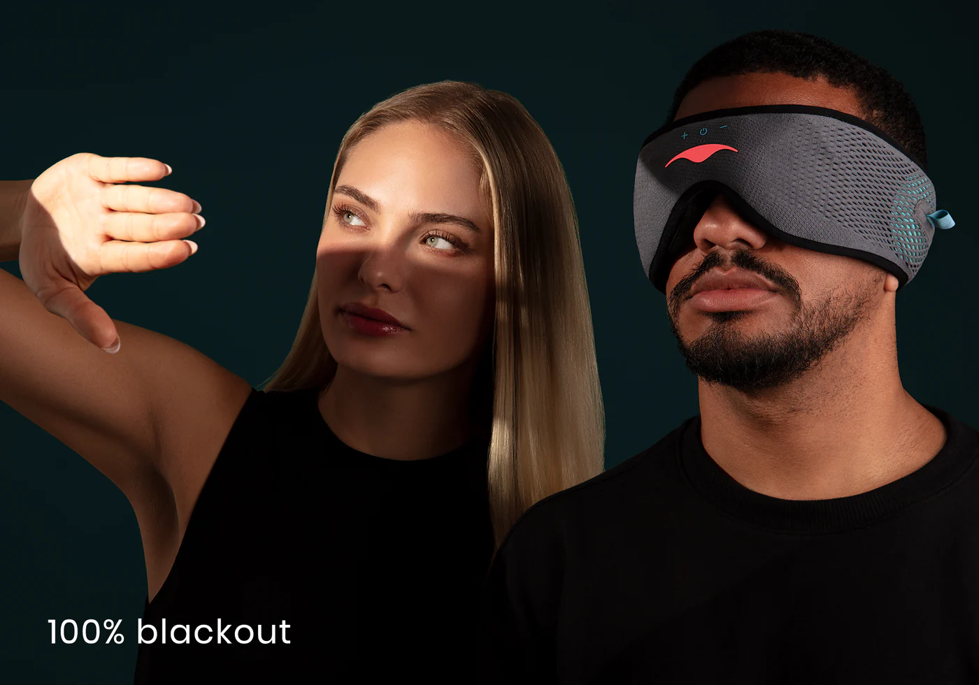 A woman shielding her eyes from the light. The man is wearing a gray sleep mask with headphones, considered the best meditation eye mask.