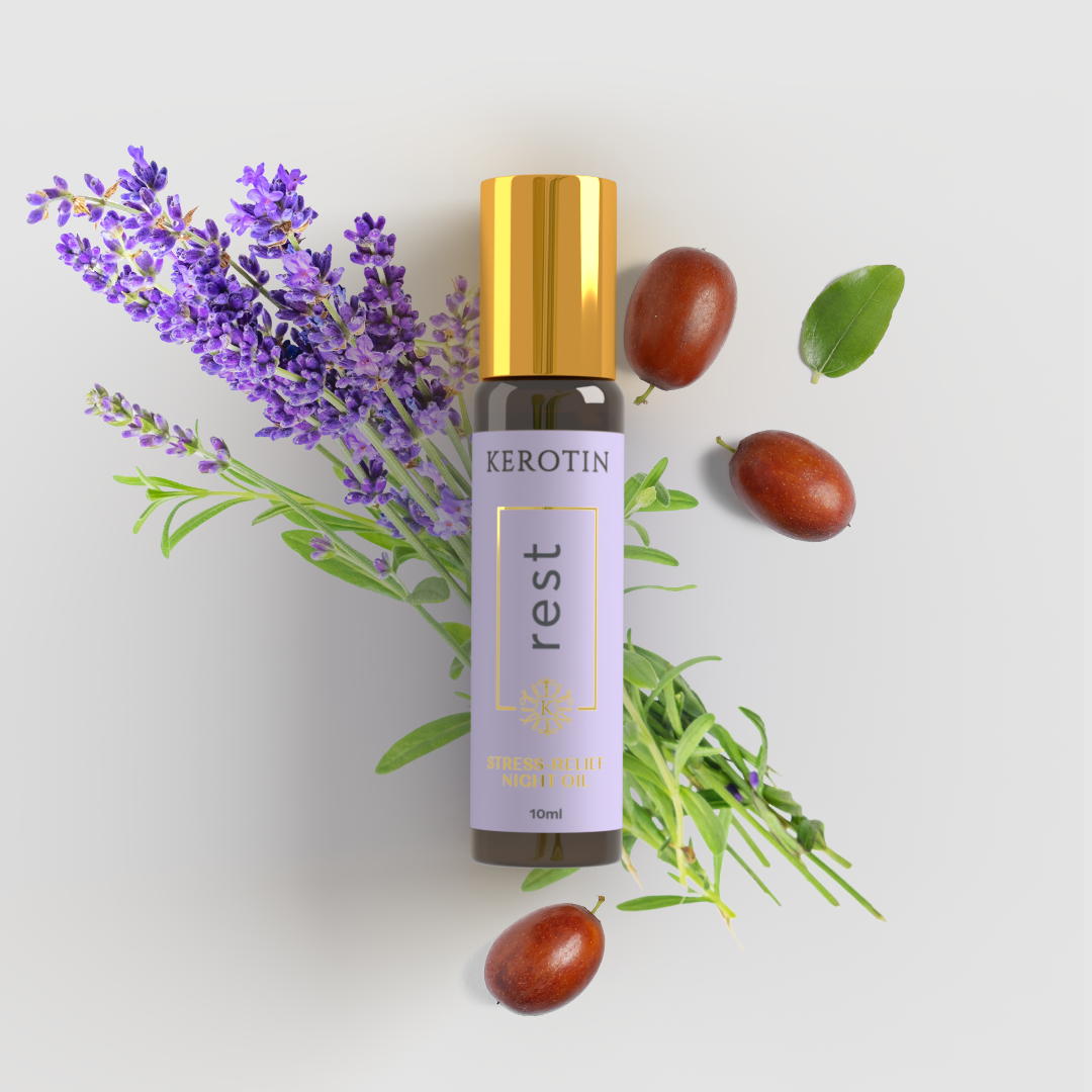 Night stress-relief oil called rest, placed on lavender and jojoba seeds