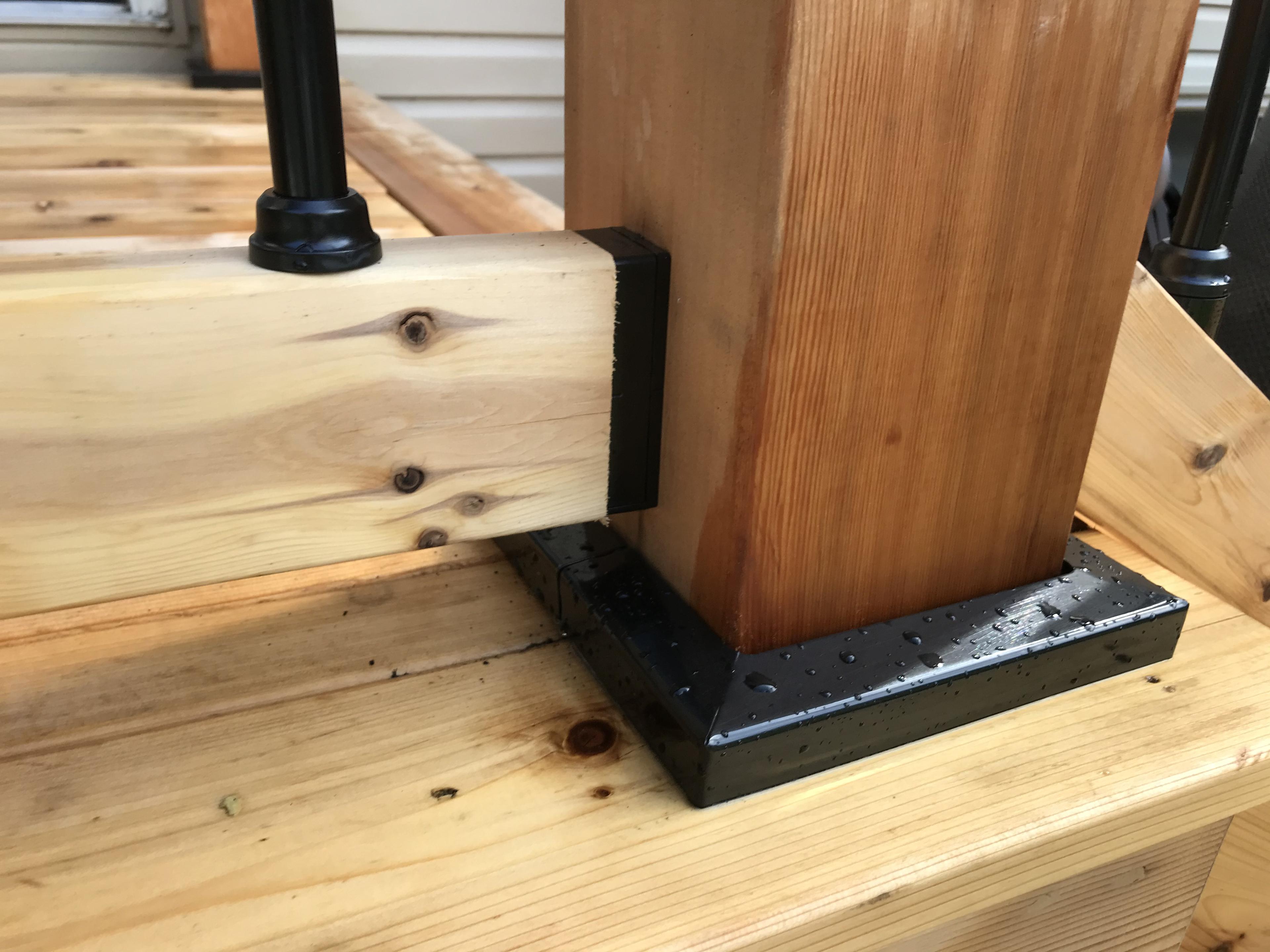 close up of the Titan post anchor supporting a 6x6 post with a post skirt hiding the hardware