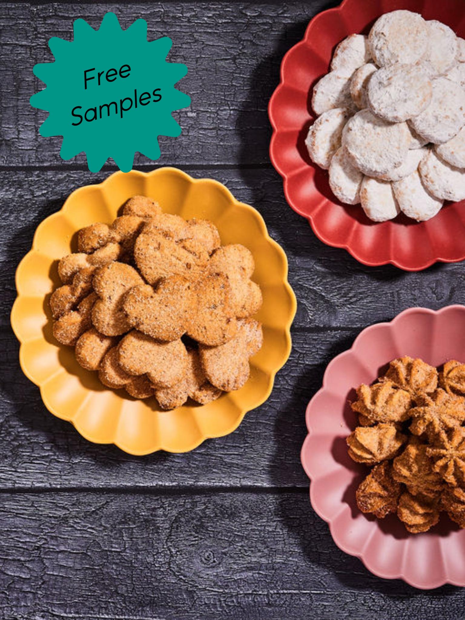 three plates of cookies on dark background