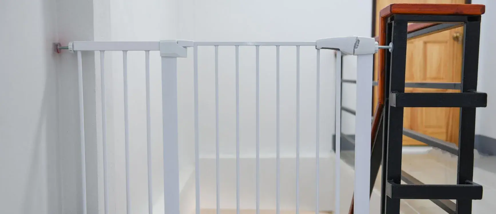Pet gate installed at the top of a staircase