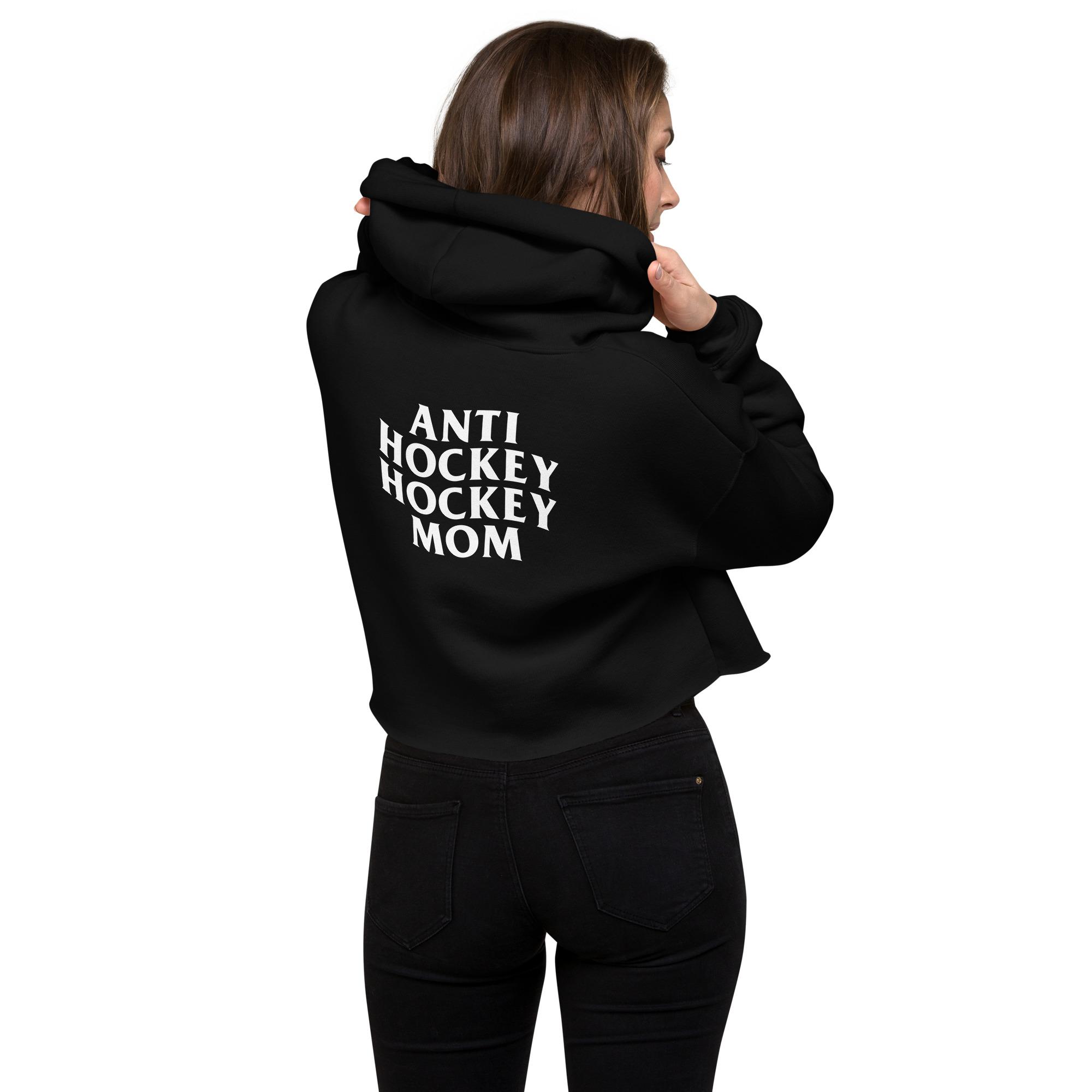 A hockey mom wearing a black anti hockey hockey mom crop hoodie