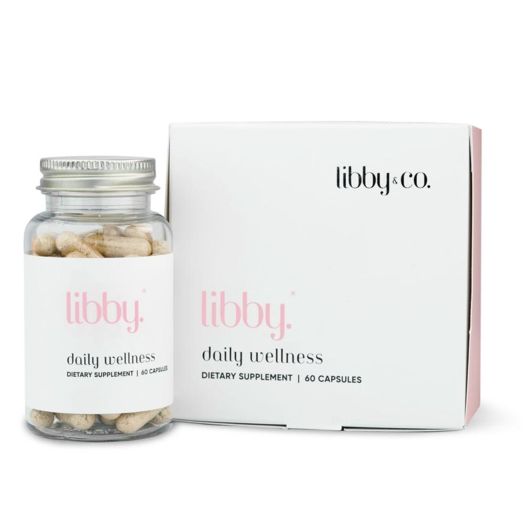 Bottle of libby. daily wellness supplement next to its box