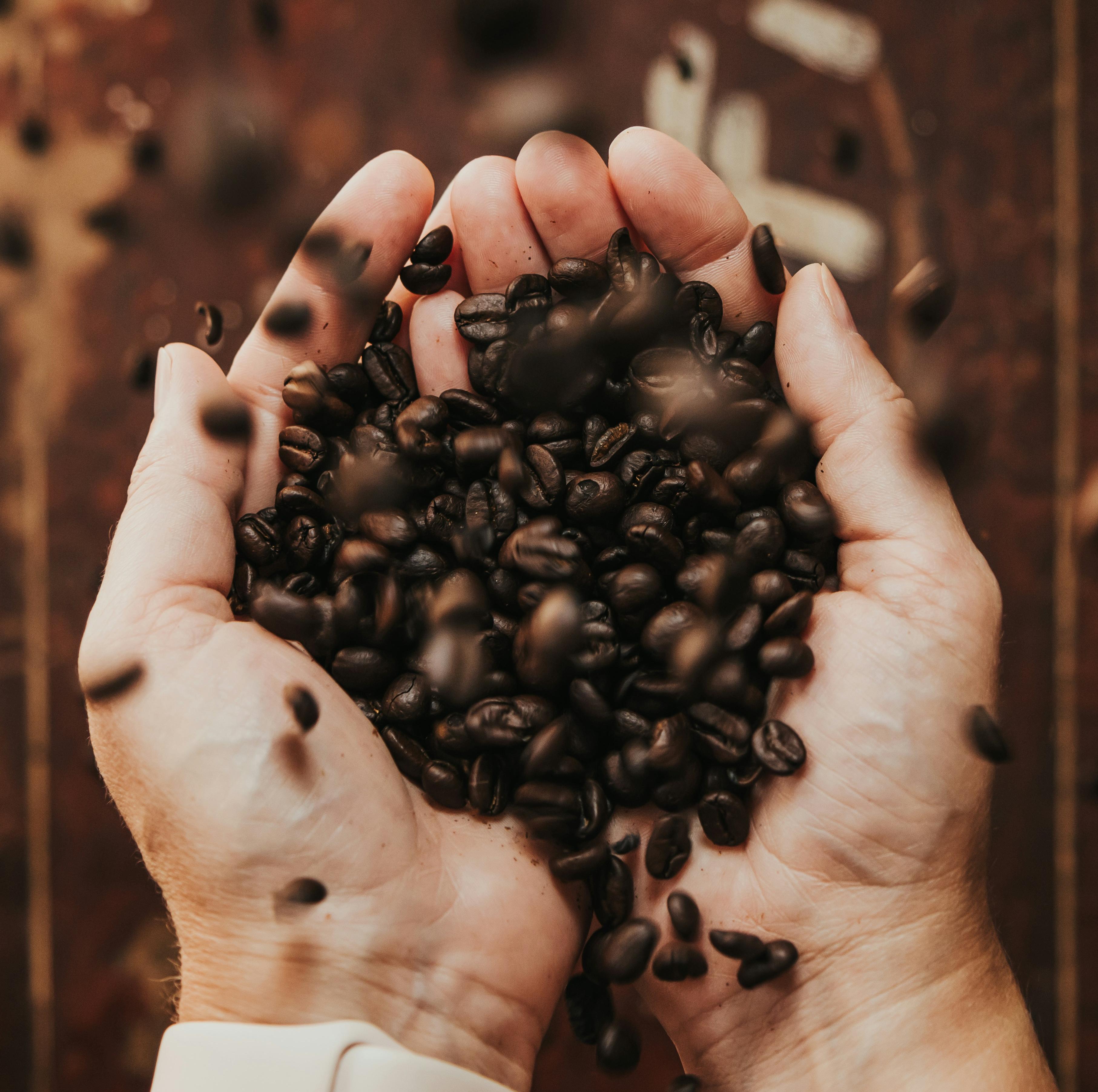 Woman Smiling with a cup of Coffee on her hands