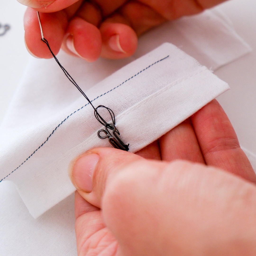 Sew a buttonhole stitch to secure the hook