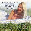 Woman relaxing on a white Royal Therapy mattress pad outdoors; an affordable upgrade for a softer bed