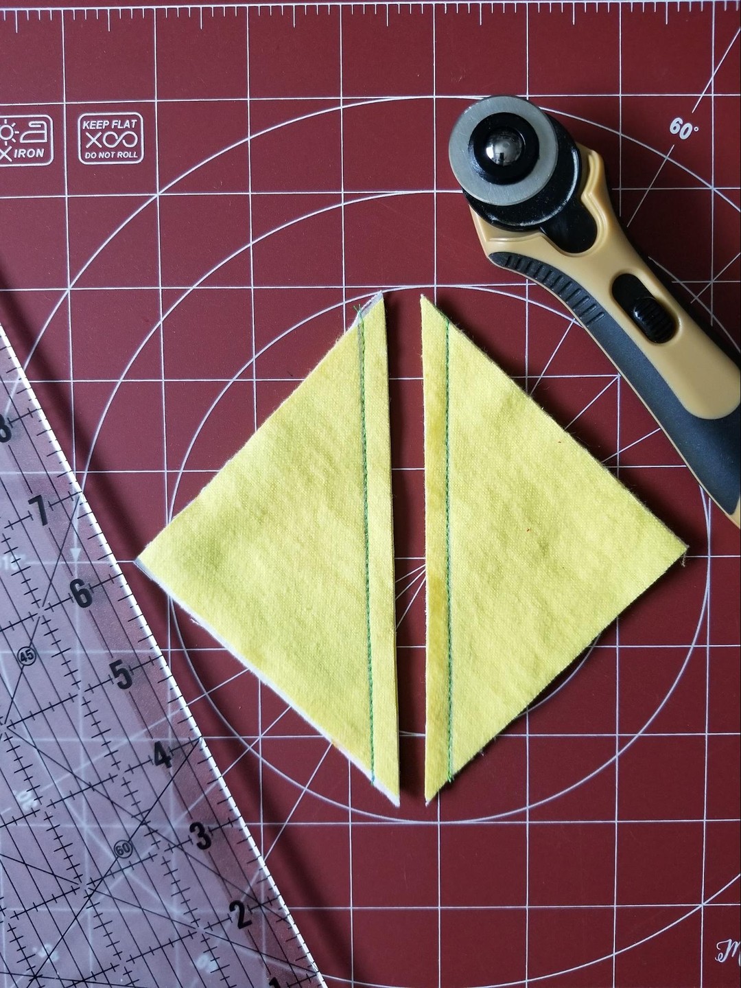 Half-square triangles...line cut between the two sewn lines that were measured out with QIPS