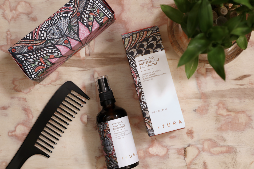 iYURA Ambhring with its beautiful Madhubani painting packaging and a comb.