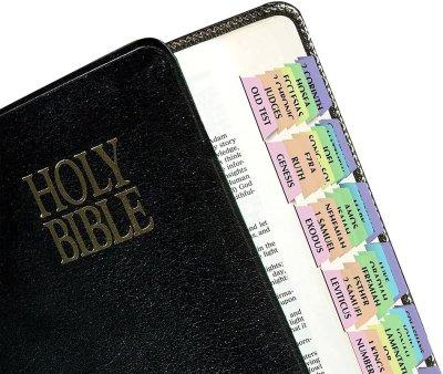 Bible with color-coded book tabs in soft pastel colors