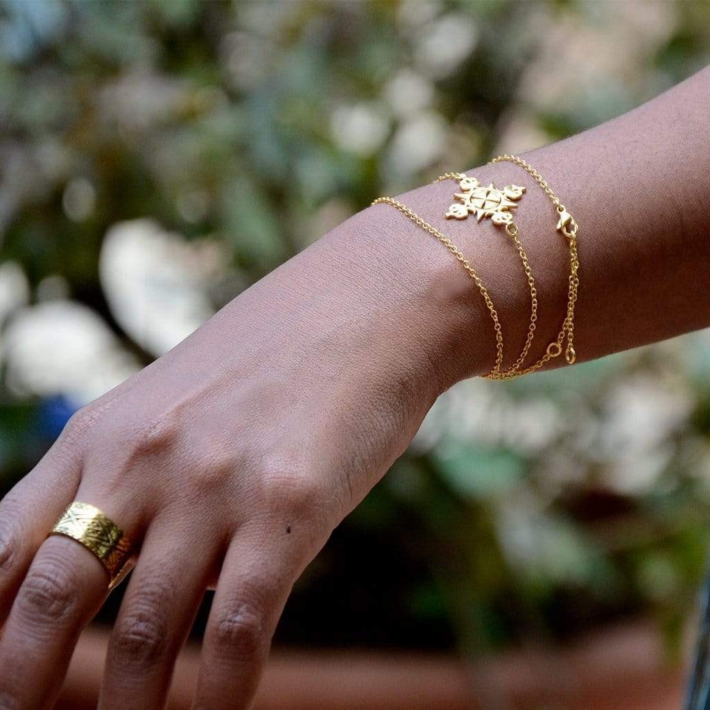 Yenaé Model Wearing Lalibela Cross 14K Gold Plated Necklace As A Bracelet