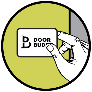 Illustration of a hand placing a Door Buddy adhesive mount onto a door frame. This step shows sticking the Door Buddy strap components onto the door and door frame.