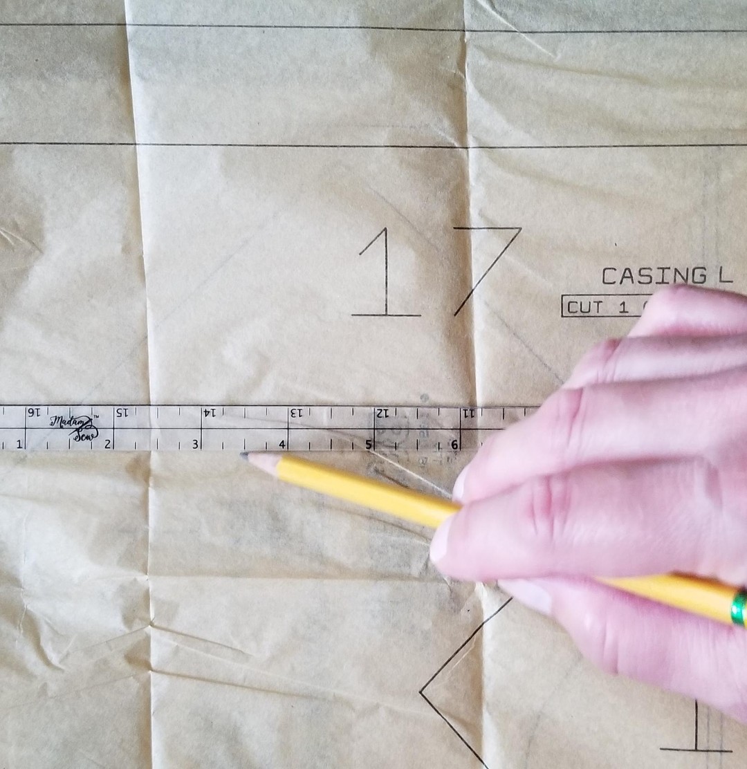 Making a 1/2" adjustment line on a pattern using a Quarter Inch Patchwork Ruler "IP"