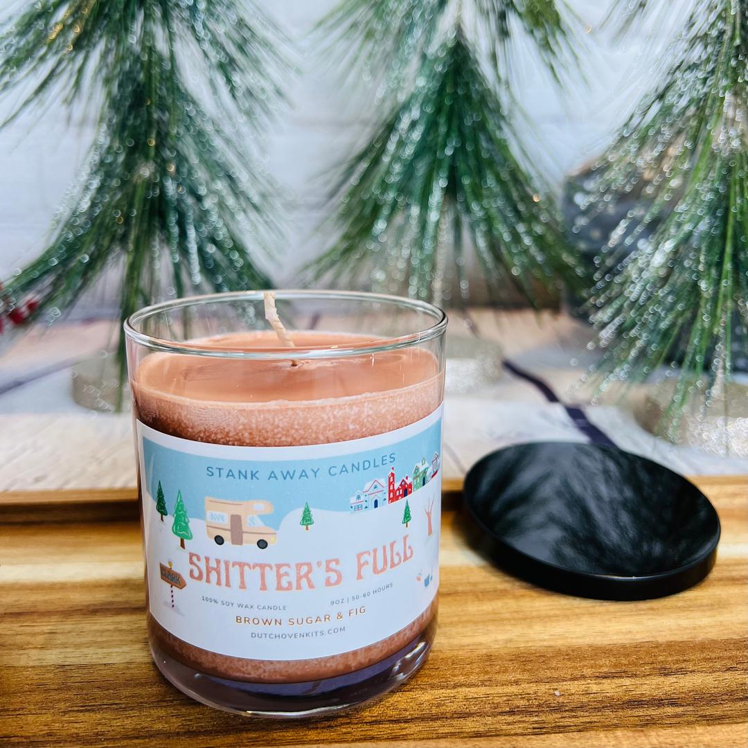 a brown brown sugar and fig candle with an rv on a christmas background. Shitters full