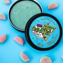 An open tin of dirty dangles sour watermelon hockey stick wax on a blue background with sour watermelon candies