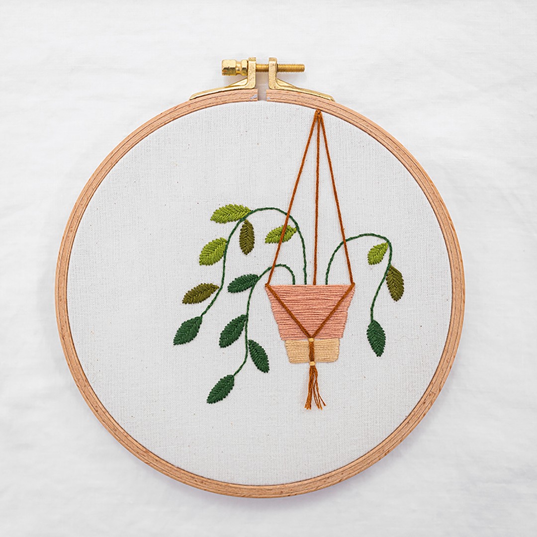 This is an image with a hanging plant created using fishbone stitch.