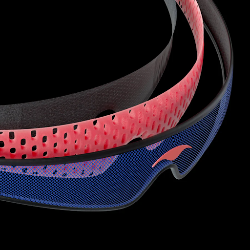 Three layers of a sleep mask head strap: mesh, perforated foam, and Tactel.