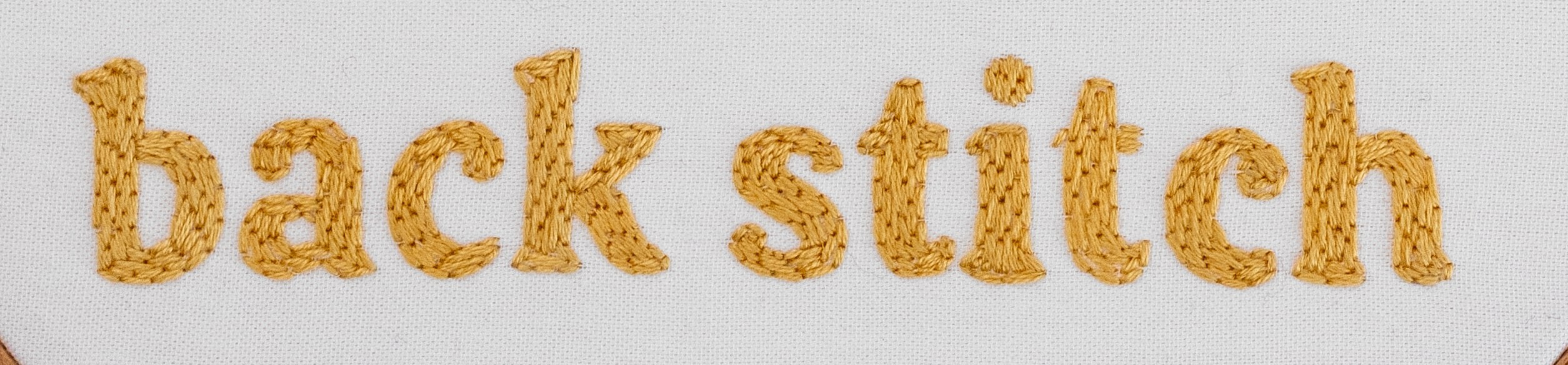This image is of a word using modern embroidery back stitch.