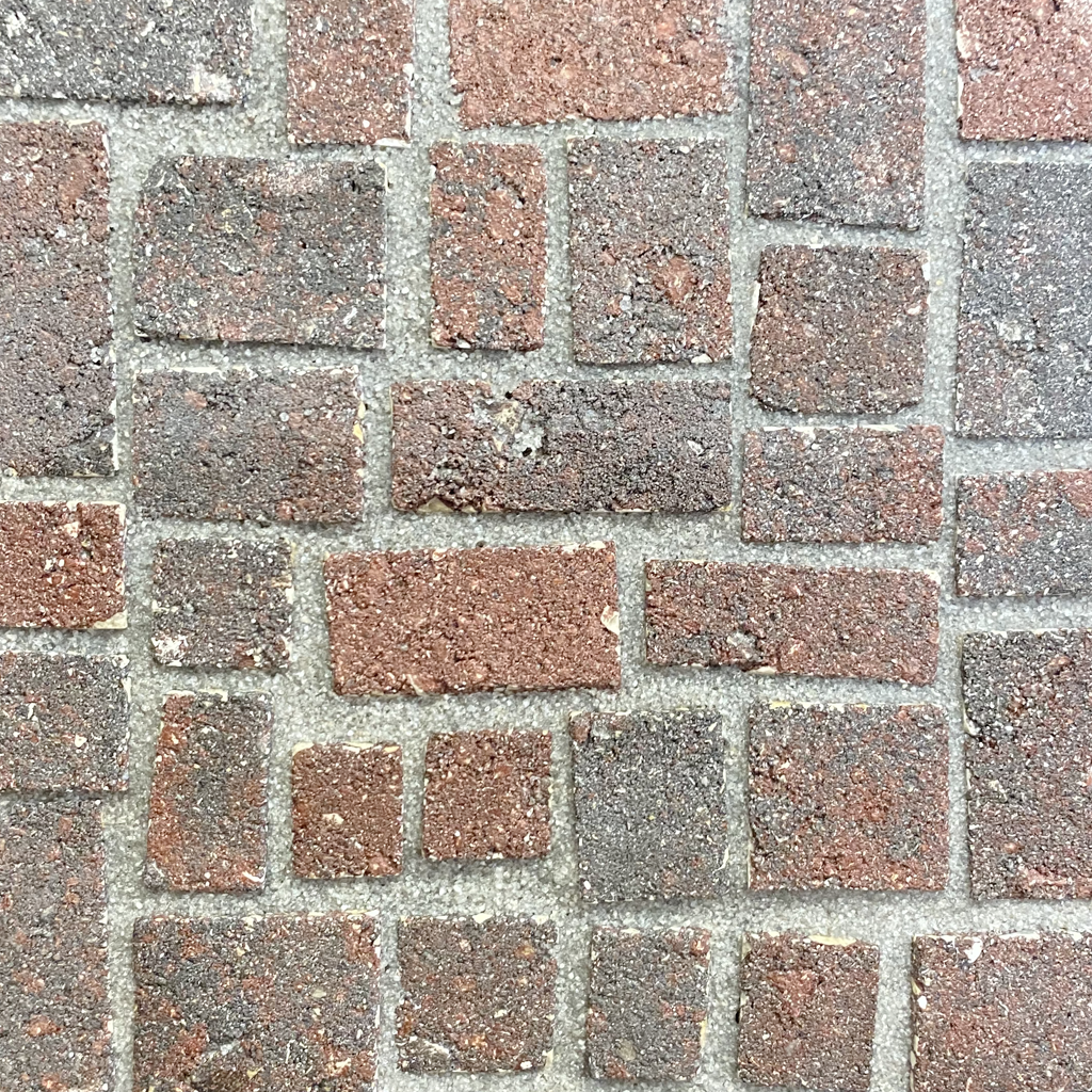Titanium on red gray brick