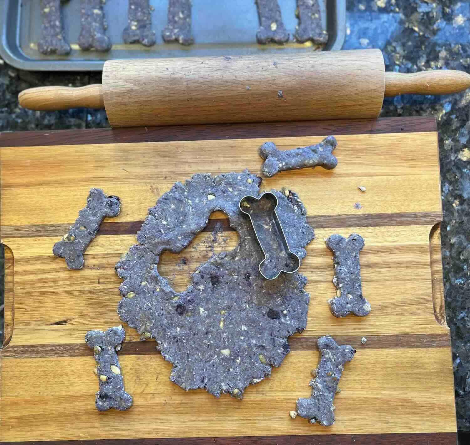 blueberry biscotti dough with dogbone cookie cutter shapes