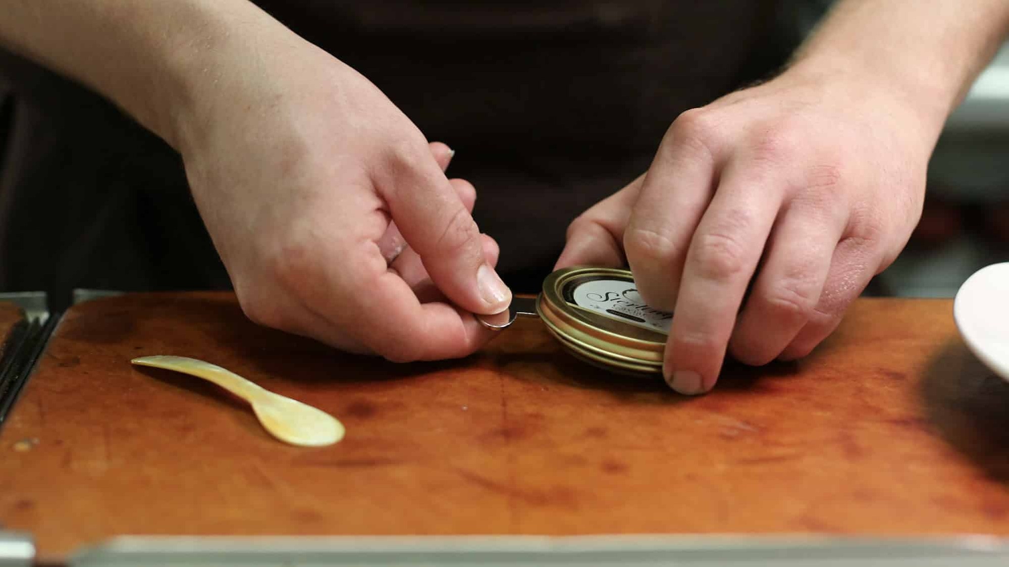 Opening a caviar tin